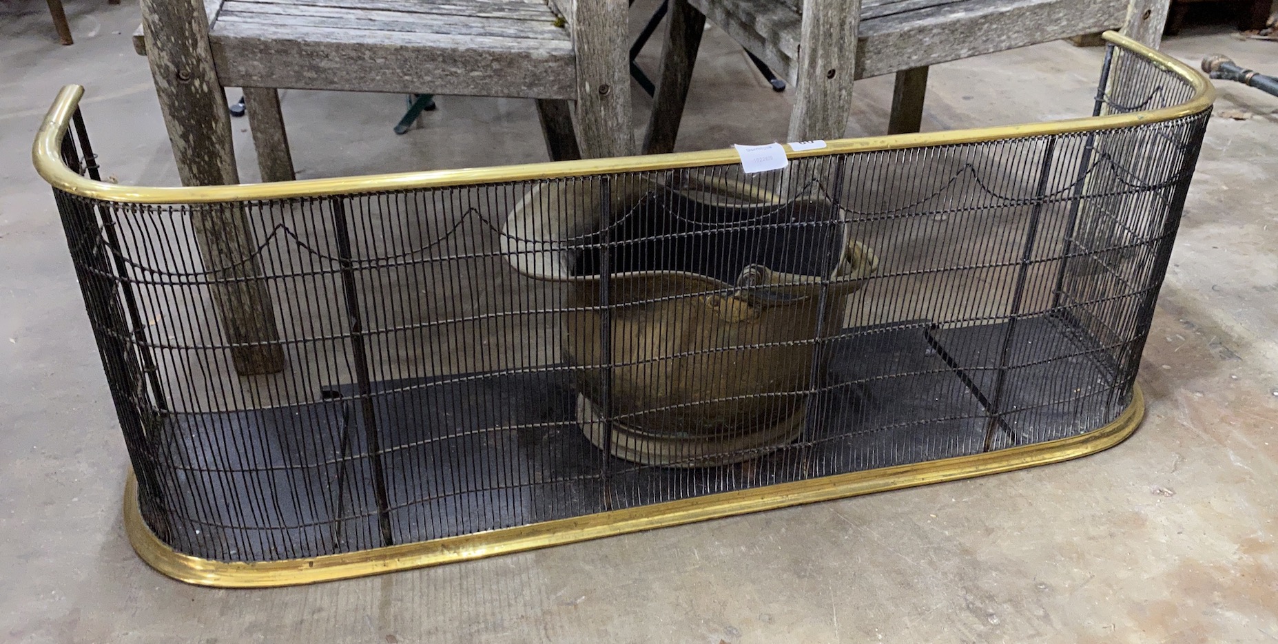 A Victorian brass tipped wire mesh fender, length 104cm together with a brass coal scuttle